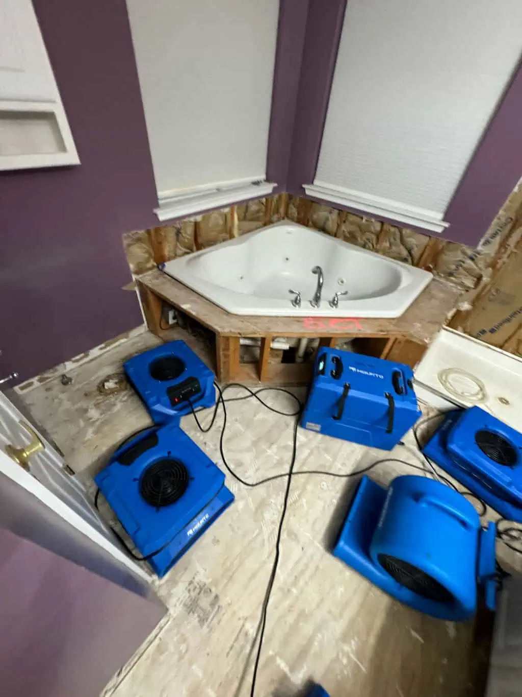 Bathroom water damage cleanup and drying process