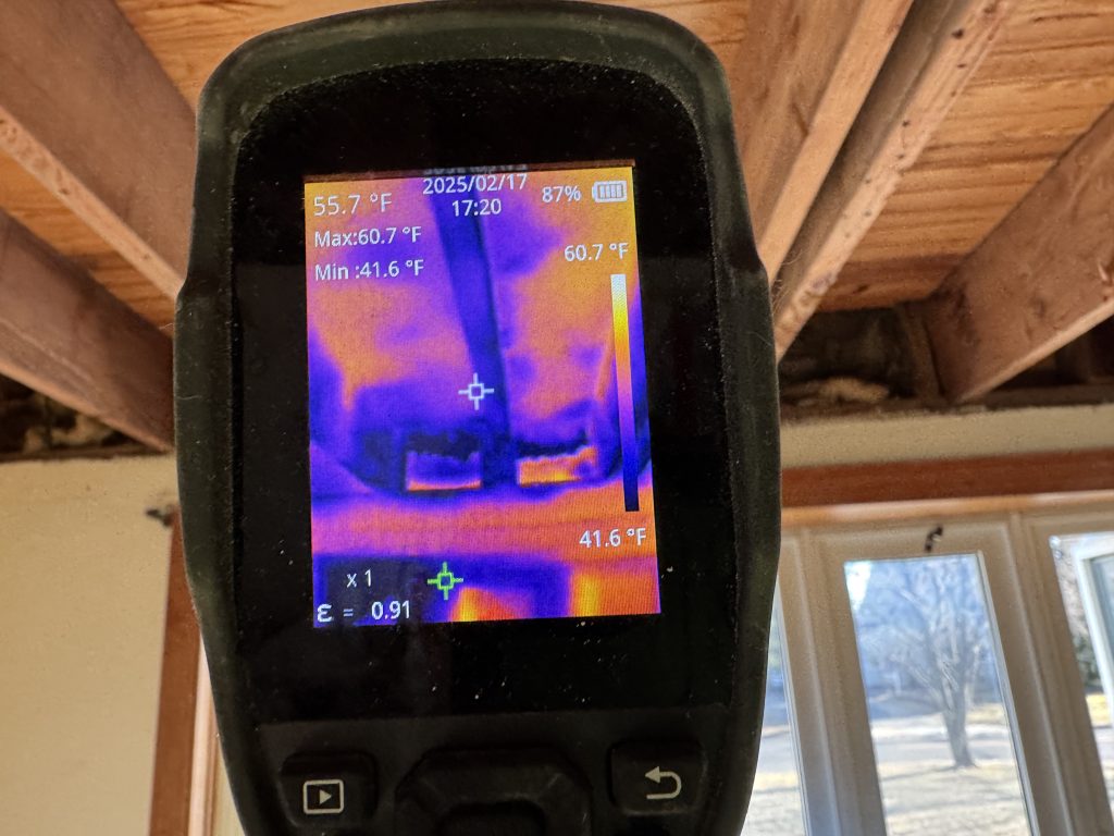 Thermal camera showing temperature variations in ceiling during moisture inspection